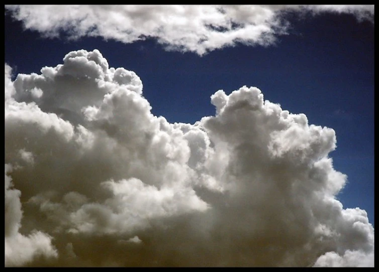 a view from the ground showing clouds in the sky