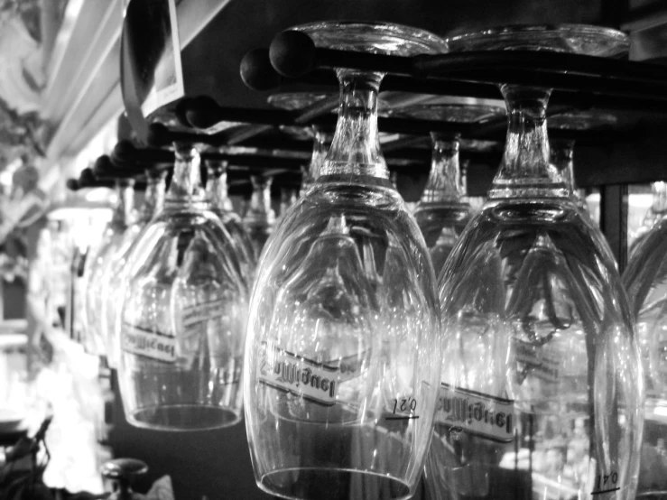 five wine glasses are sitting on a shelf