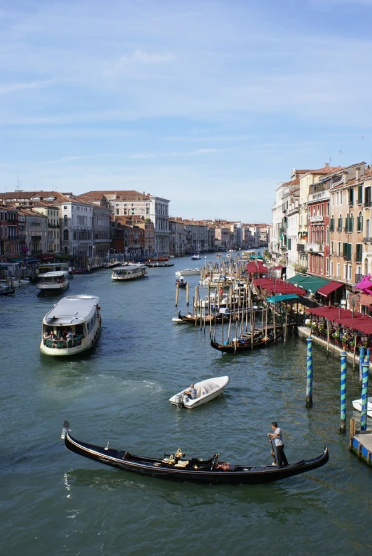 a river with several boats and some buildings