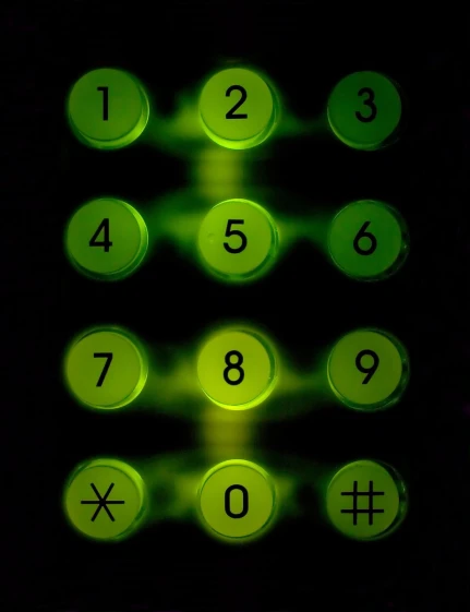 an illuminated green phone with the numbers four three four five seven