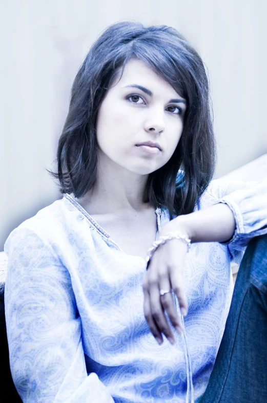 a woman sitting in the middle of a room