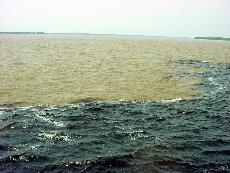 a large body of water with waves on it