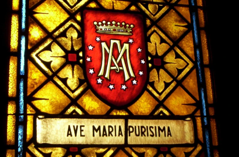 an ornate glass is displayed in front of a window