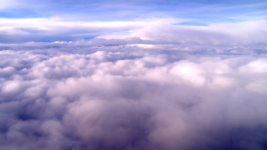 some white clouds and blue sky above it