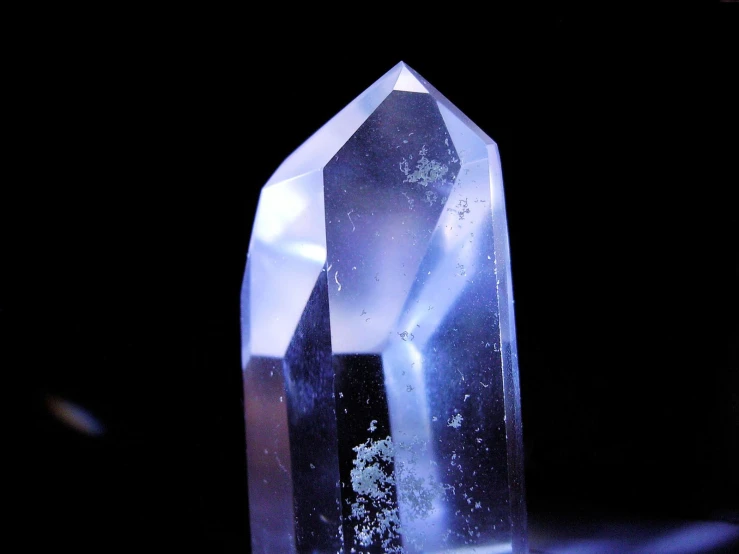 a big blue crystal on top of a table