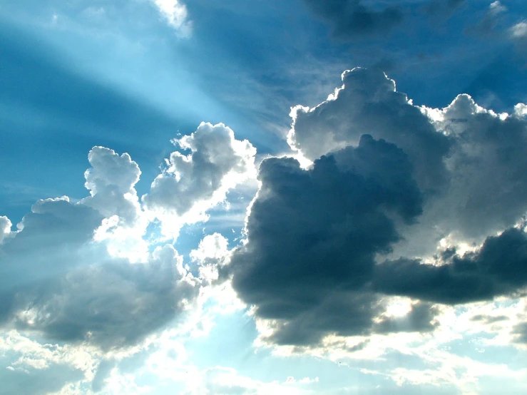 a bright cloud with sunbeams in the middle