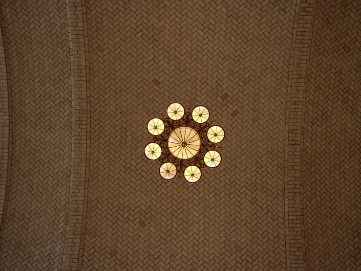 the ceiling above the kitchen is decorated in gold and brown