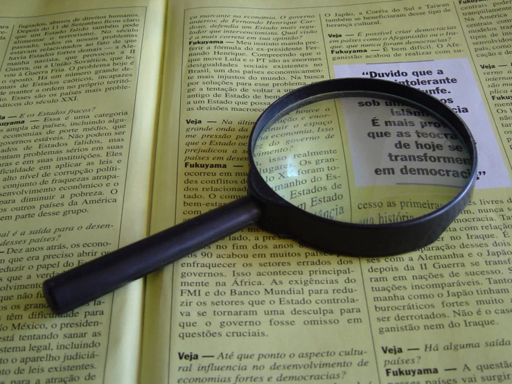 a magnifying glass resting on top of a page