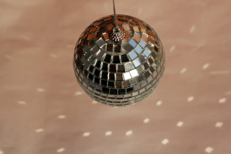 the back side of a disco ball on a wall