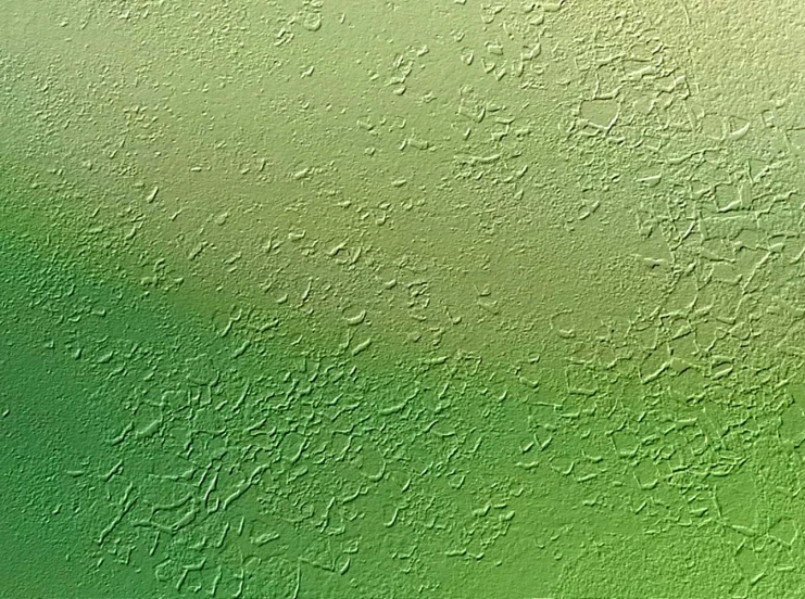 a very bright green background with small drops
