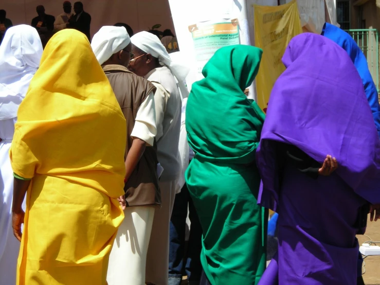 many people with robes of different colors