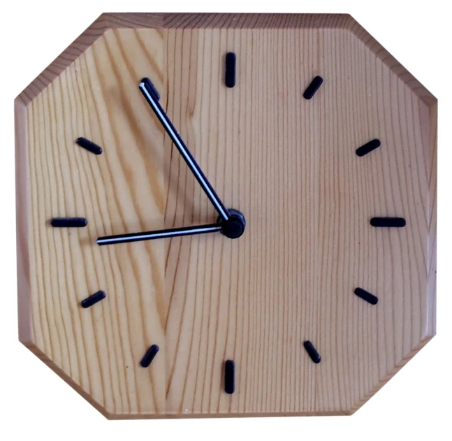 a close up of a wood clock with black numbers on it