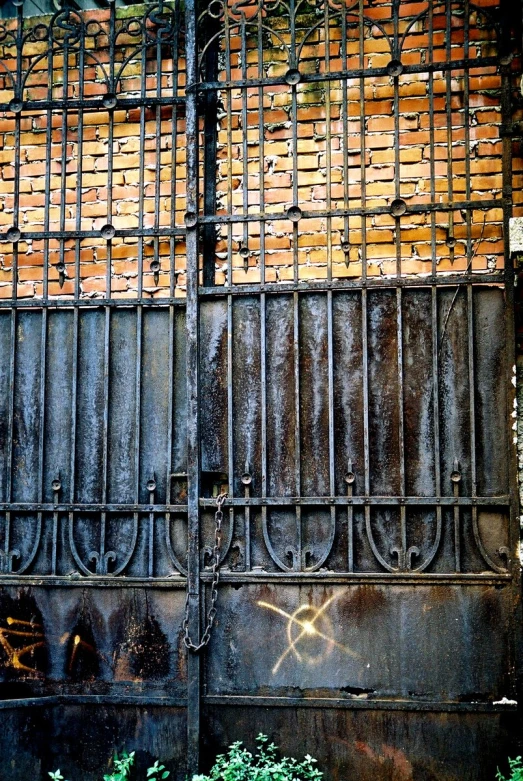 a rusted metal gate with several bars