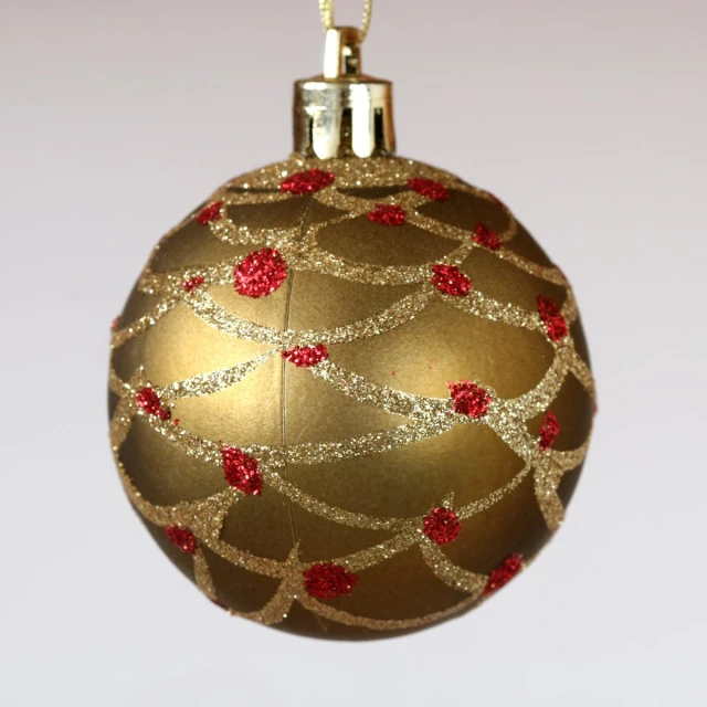 an ornament in gold and red is a decoration