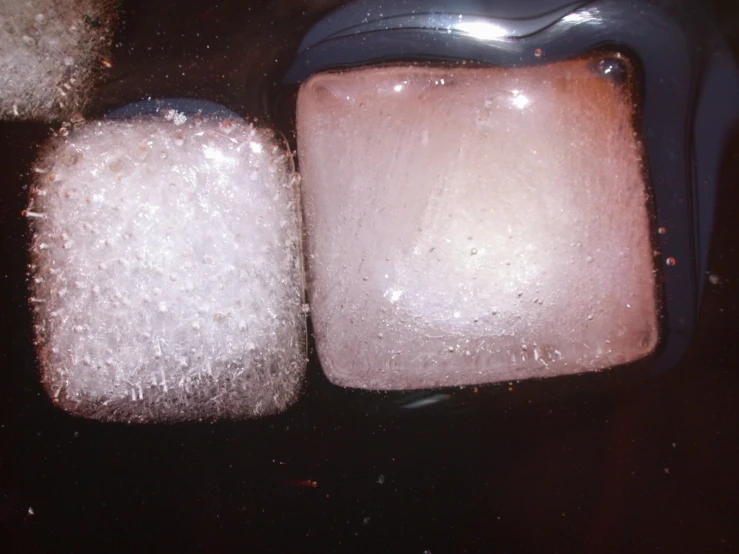 there are two pieces of ice sitting on the table