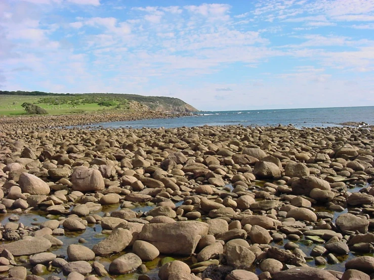 rocks and water on the coast by a rocky shore