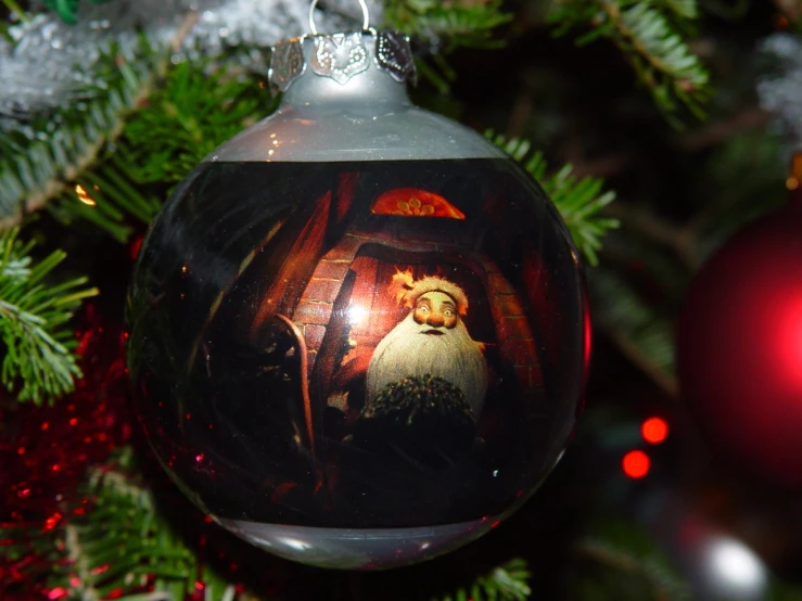 a glass ball ornament that has a nativity scene in it