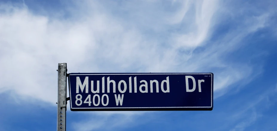 a street sign for the intersection of mulholland drive and 4800 w
