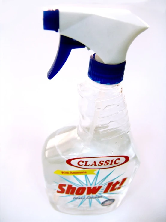 a clear glass bottle with an air freshener sprayer on top