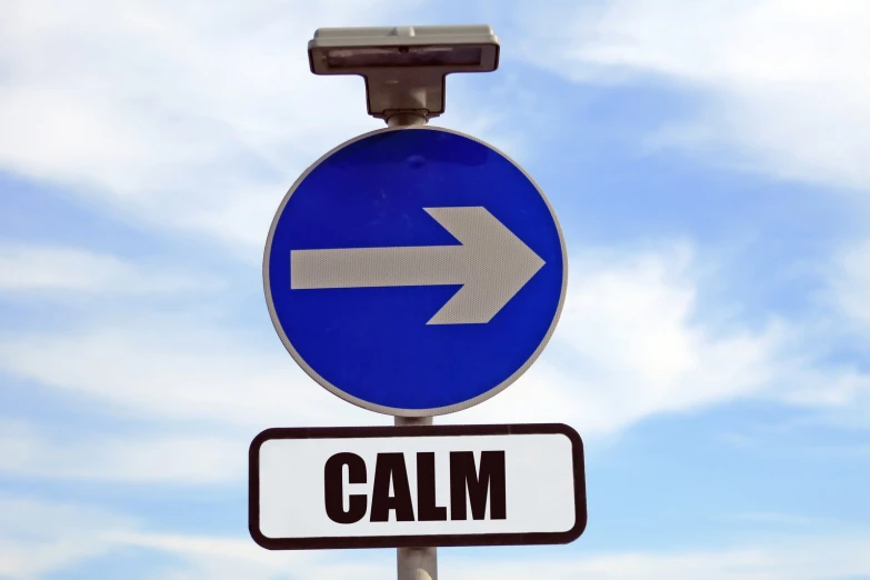 an arrow and sign with the word calm on it