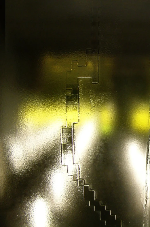 a close up of a metal surface with bright light