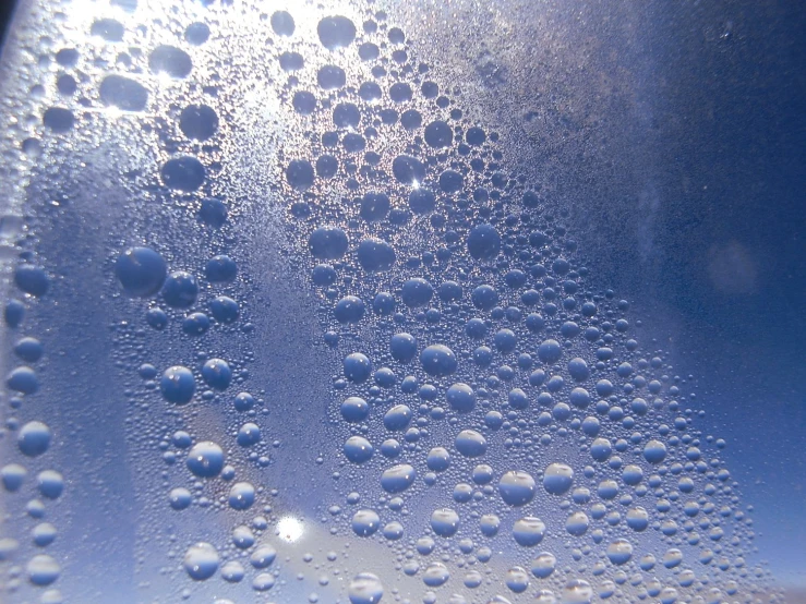 bubbles of water are being made into a blue sky