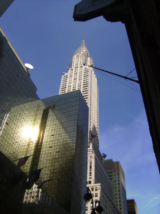 the skyscr is tall and clear against the blue sky