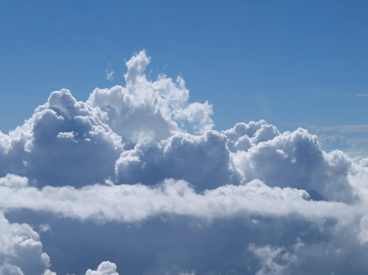 a bunch of very large clouds in the sky