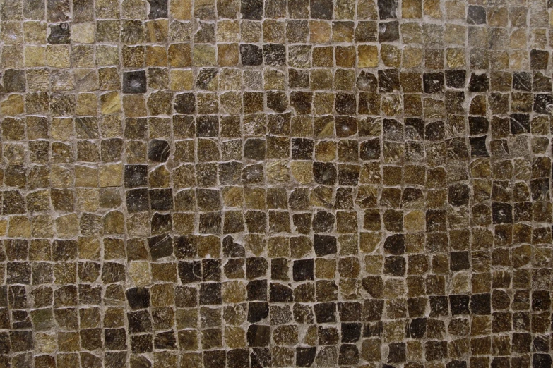 a bathroom with an artistic textured pattern of squares