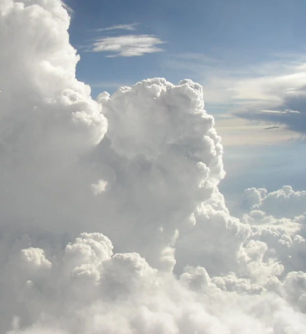 the clouds are above a big city like area