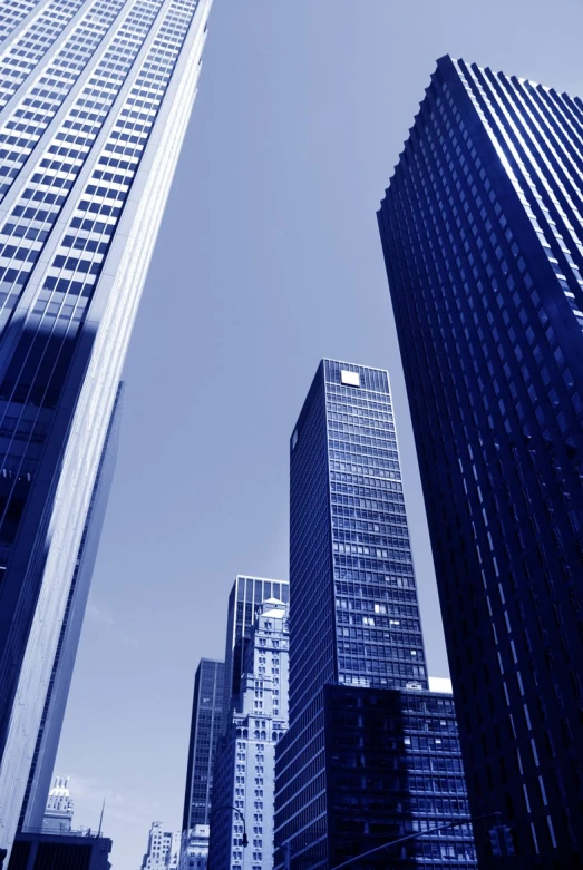 tall buildings with various spires and windows are shown