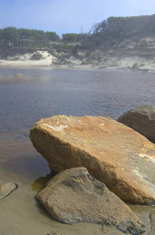 two big rocks that are sitting in the water