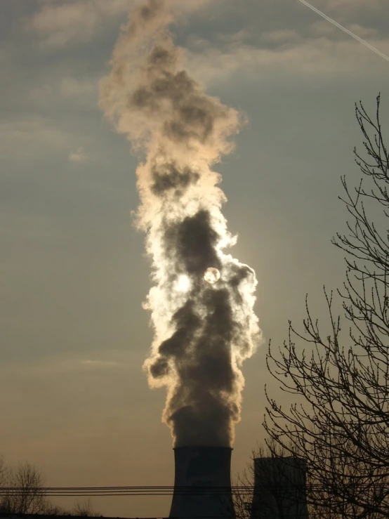 smoke comes from chimneys and steam rises in the air