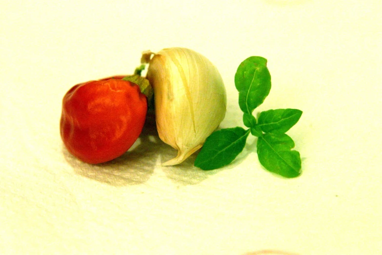 two pieces of vegetable sitting side by side on top of a table