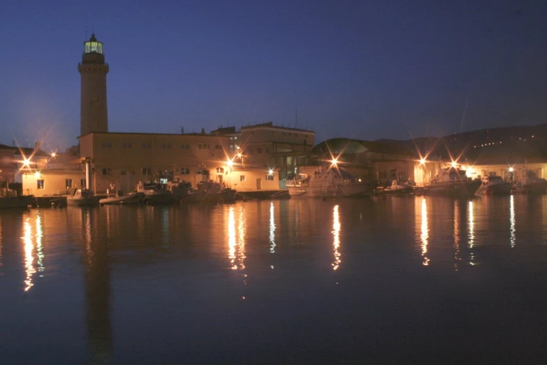 the lights reflect off the water in the city