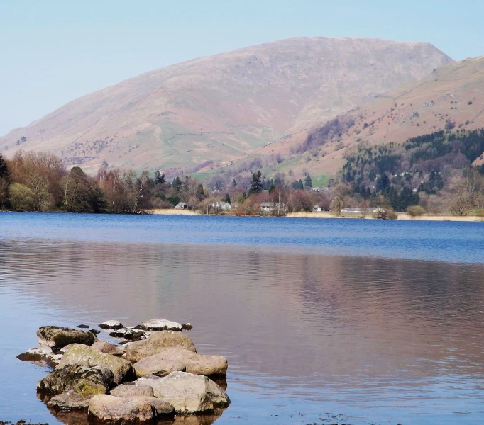 a lake with many rocks laying on it