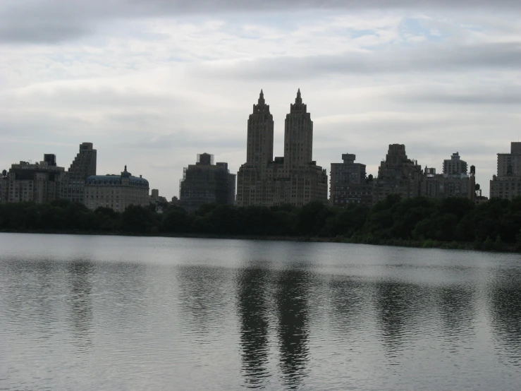 a bunch of buildings and water in a big city