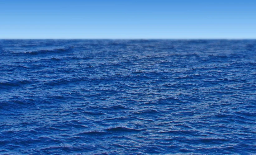 the ocean with blue water and clear sky