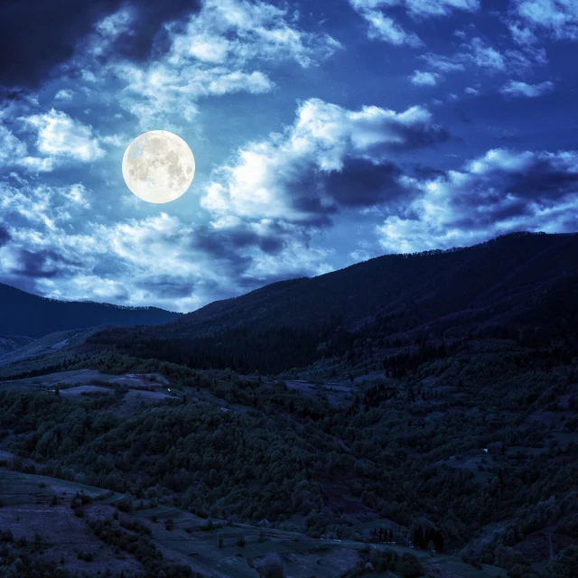 night scene with full moon, mountains and sky