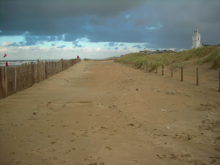 an empty sandy road with no cars on it