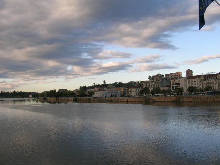 a lake in a city with buildings on the shore