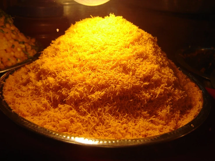a metal tray filled with a large mound of yellow cake batter