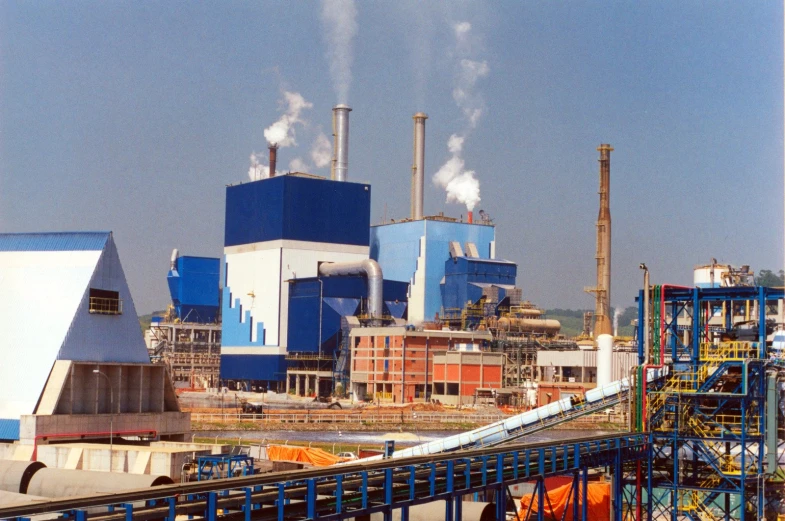 an industrial area with factory buildings and smokestacks