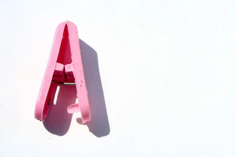 a toy model of a plastic pink object