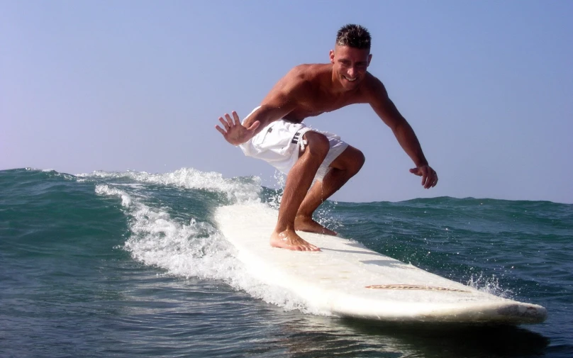 a man on a surfboard in the water