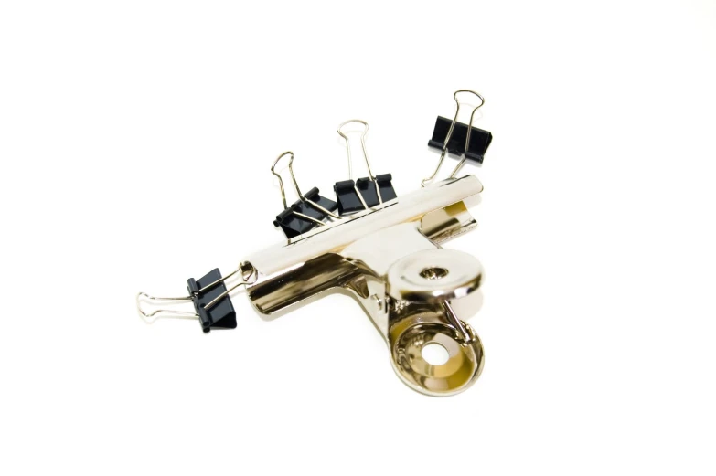 the clip - ons and earpieces of an instrument are resting against a white backdrop