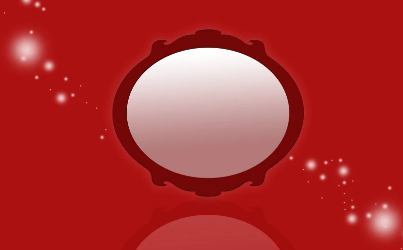 an oval mirror sitting on top of a red surface