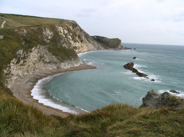 there is a long view of the water and rocks