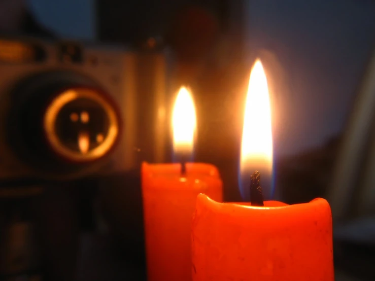 there are candles on the table with camera