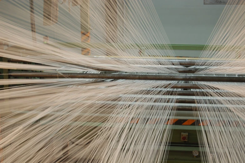 the loom of some sort being used in a weaving workshop